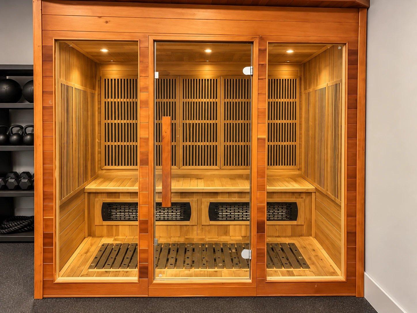 The cedar infrared sauna at Altman Fitness, with a glass door and bench seating